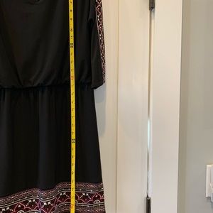 XS black dress embellished with heavy burgundy/white threading peep hole sleeves